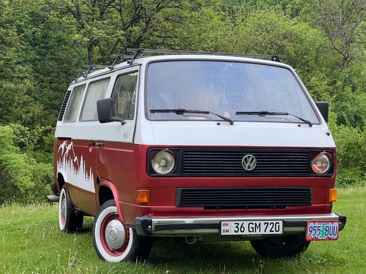 Red-and-white Volkswagen T3 campervan, front view